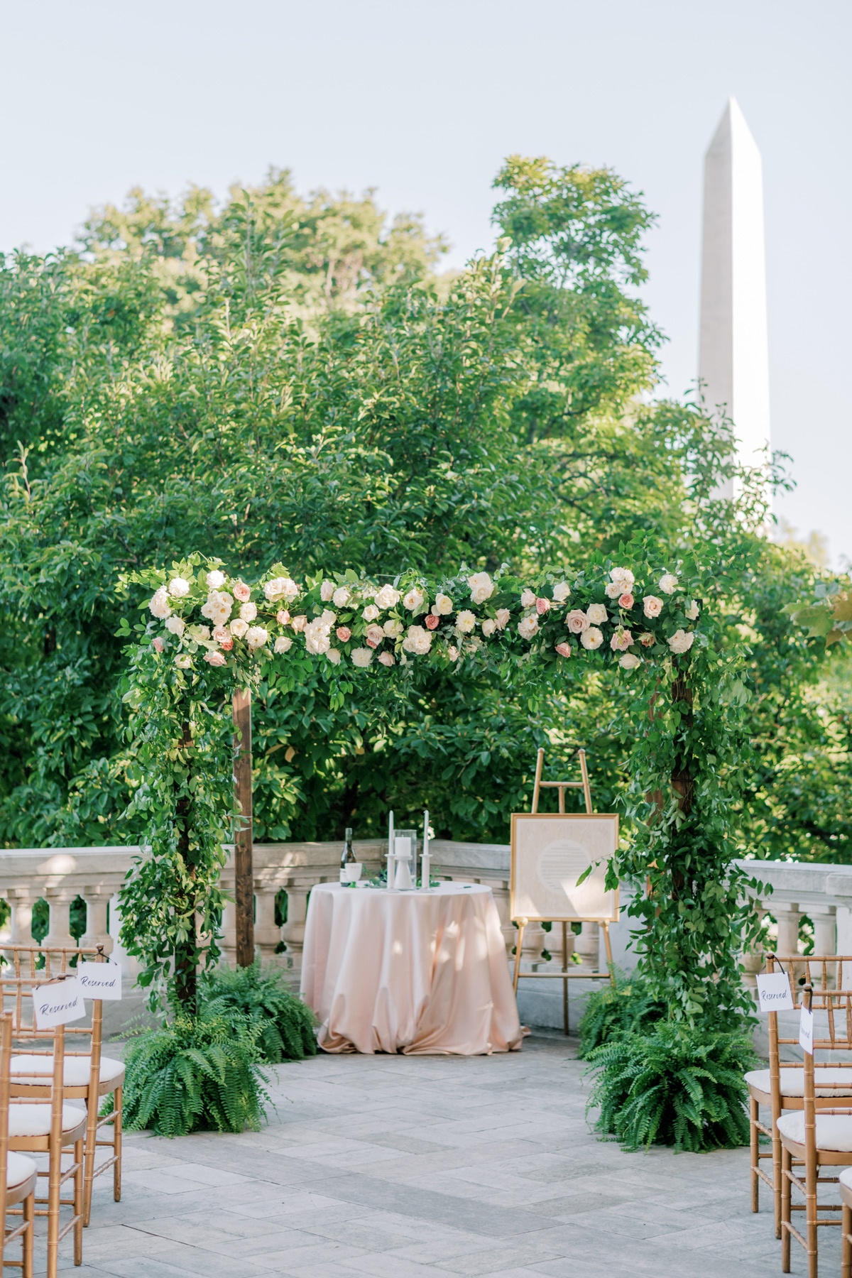 elegant wedding floral chuppah overlooking the washington monument
