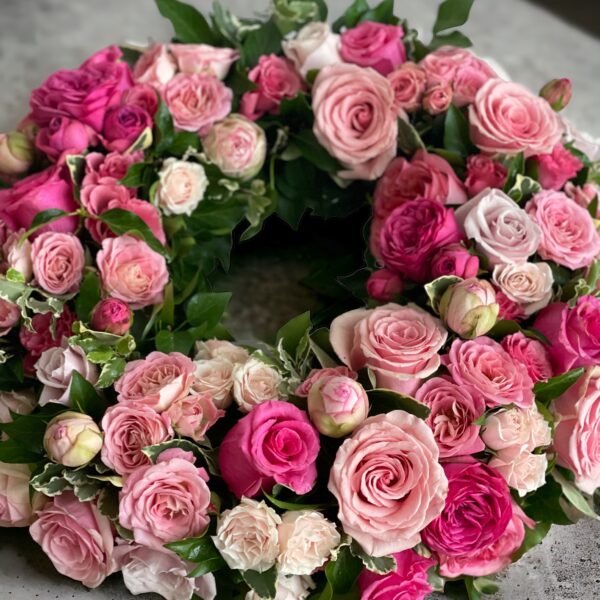 fresh floral wreath with shades of pink flowers